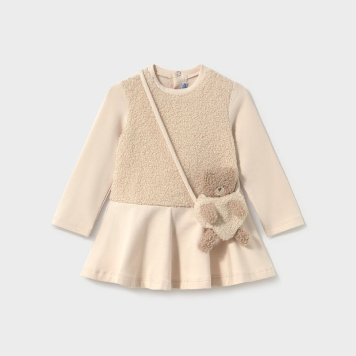 Dress Paired With a Baby Bear Handbag